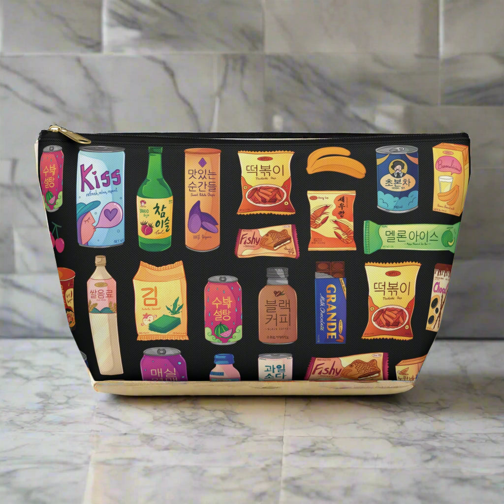 Pouch with colorful Korean snacks illustrations on a black background