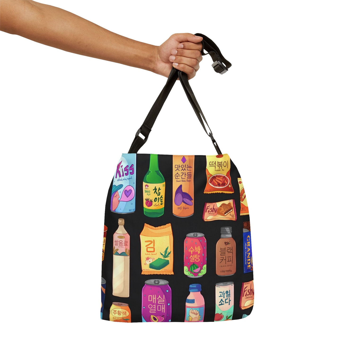 Black bag with colorful drink illustrations held by a hand on a white background