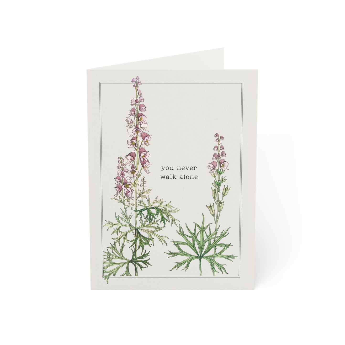Greeting card with floral design and text 'you never walk alone' on a white background