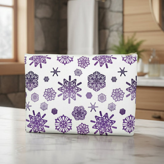 Rectangular pouch with purple snowflake pattern on a white background