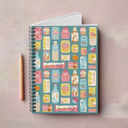 Notebook with product packaging design on a blue background