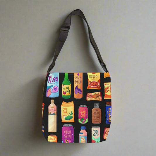 Crossbody bag with colorful product illustrations on a black background