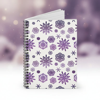 Notebook with purple snowflake pattern on a white background