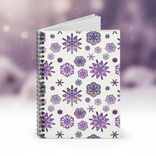 Notebook with purple snowflake pattern on a white background