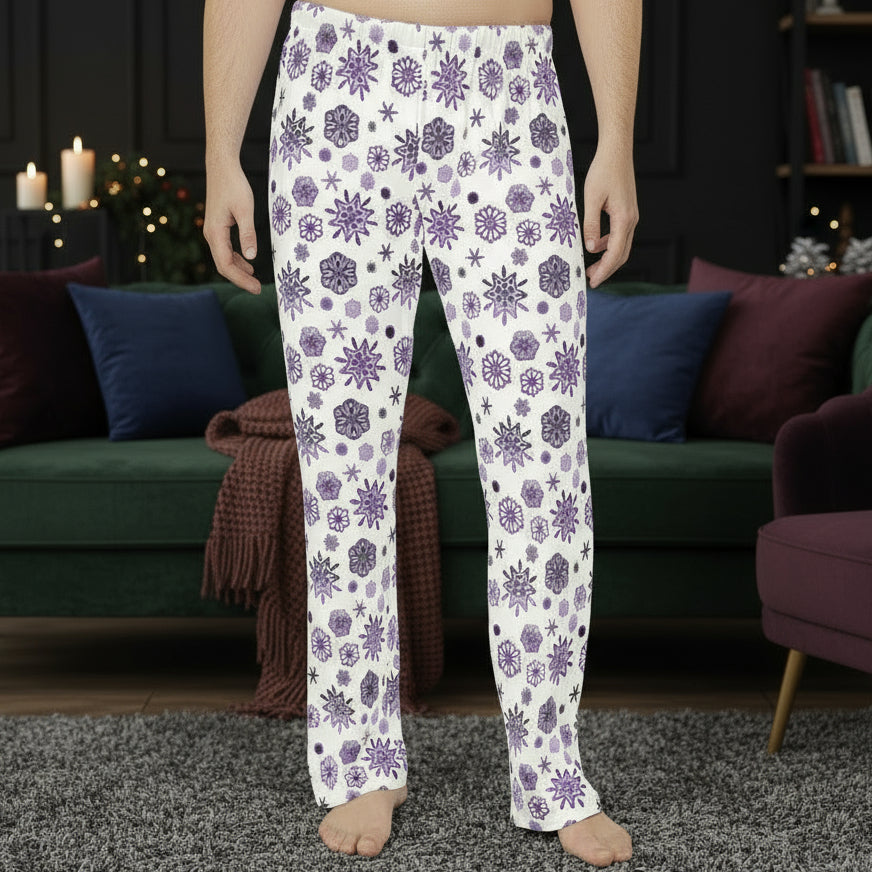 Person wearing white pajama pants with purple snowflake pattern