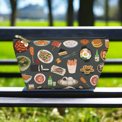 Pouch with Korean food illustrations on a dark background