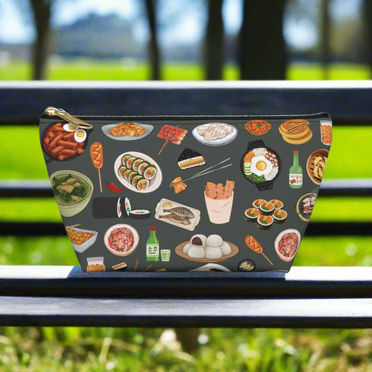 Pouch with Korean food illustrations on a dark background