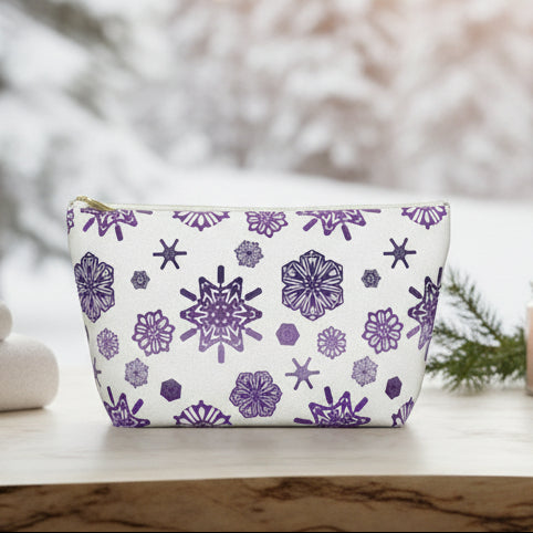 Pouch with purple geometric pattern on a white background