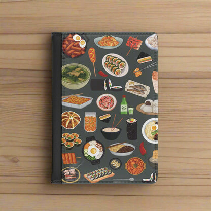 Passport wallet with a colorful food illustration pattern on a grey background