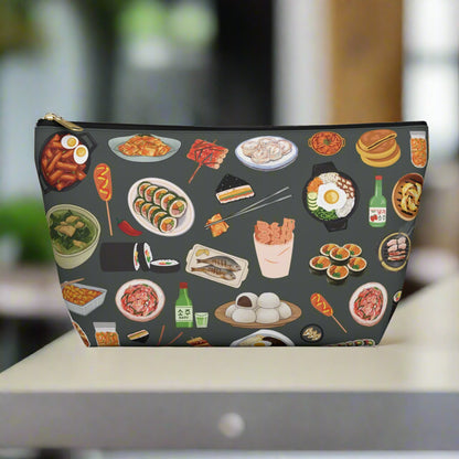 Pouch with various Korean food illustrations on a dark background