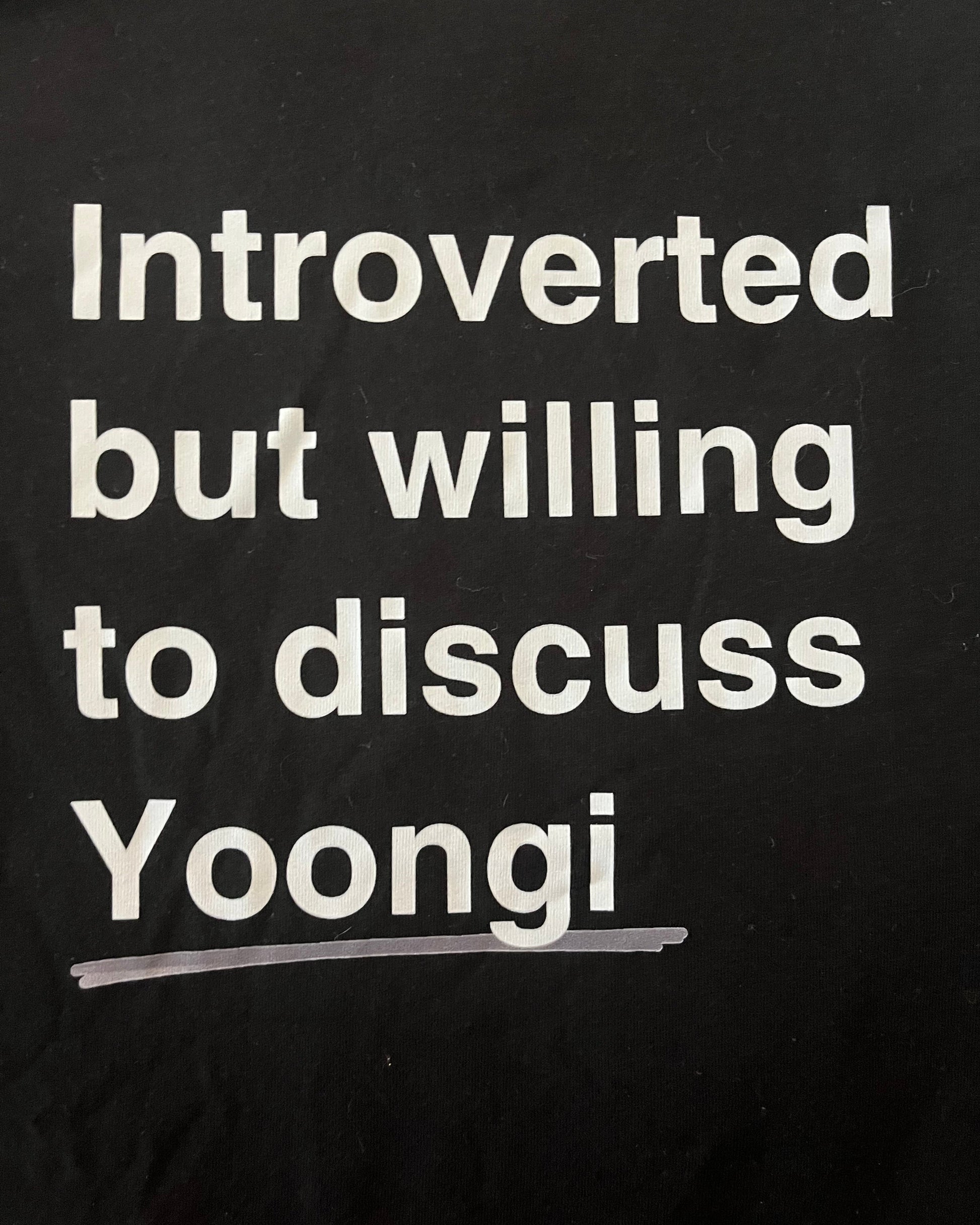 Black shirt with white text 'Introverted but willing to discuss Yoongi' on a black background
